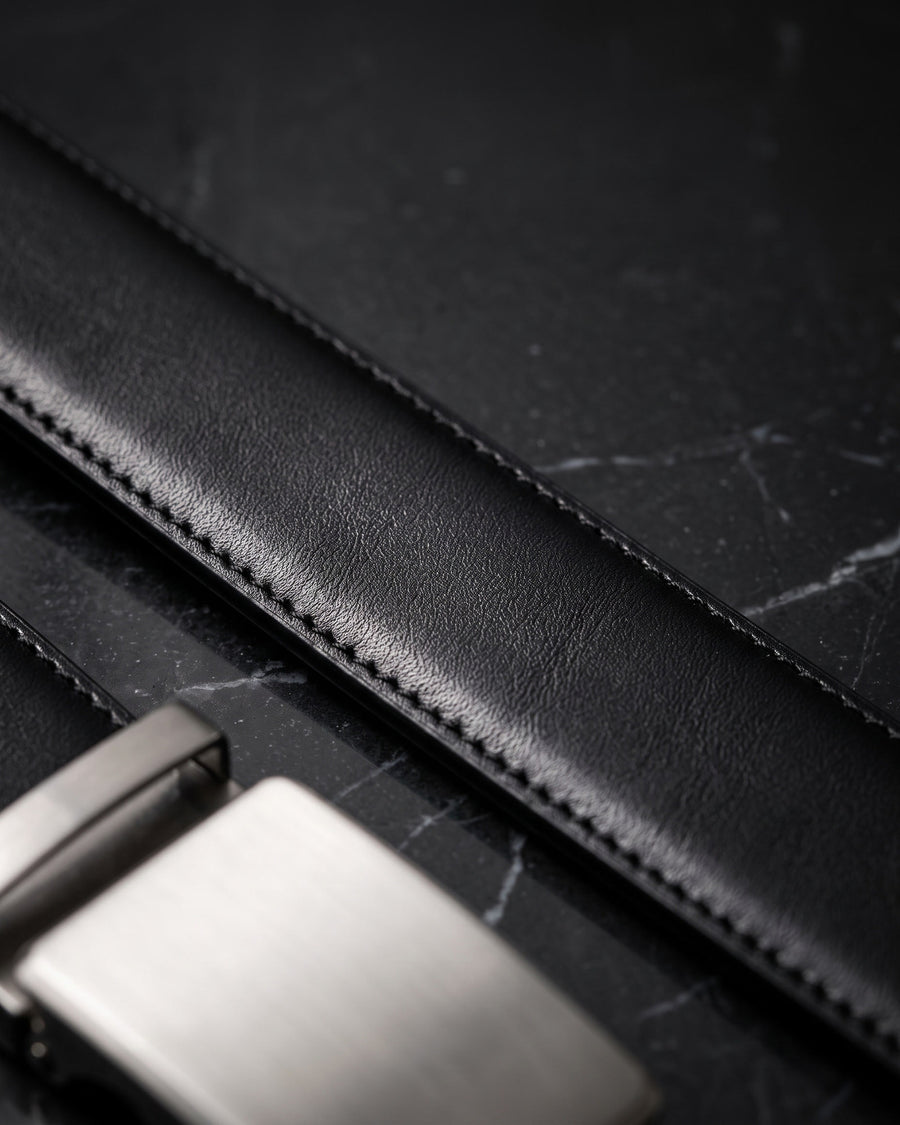 Harrow automatic Italian leather belt, brushed silver buckle, black strap – full-grain Italian leather close-up